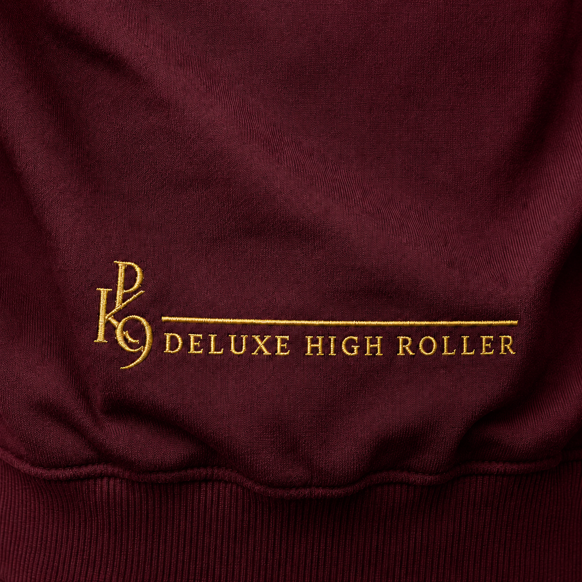 Deluxe High Roller bordeaux – gros plan broderie bas du dos or
